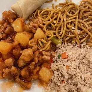 a plate of asian food with rice and a roll
