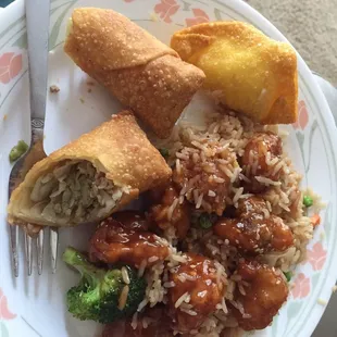 Sesame chicken dinner with fried rice and egg roll