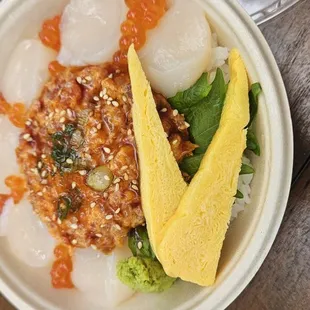 Lava Flow poke bowl (scallops, ikura, spicy Ahi, with sushi rice and egg, with shiso leaf.