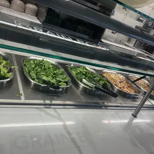 salads and salad bowls on display