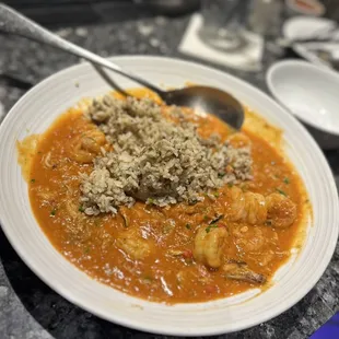 Combo Pan Roast rich lobster-citrus broth simmered with seafood and finished with tomato cream