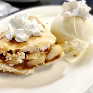 a slice of pie with ice cream on top