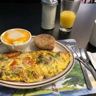 Omelet with ham, swiss, mushrooms, tomato, onion and spinach.