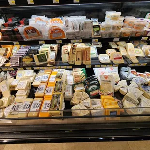 a display of cheeses and dairy products