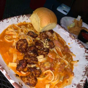 a plate of pasta and meatballs