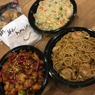 Delivery of General Tao Chicken, Shrimp chow mein, Shrimp fried rice, and complimentary spring rolls.