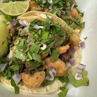 Carne asade and shrimp tacos, added guacamole