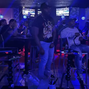 a man standing in a bar