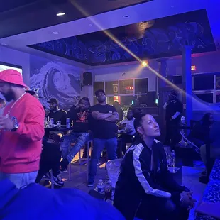 a group of people in a bar