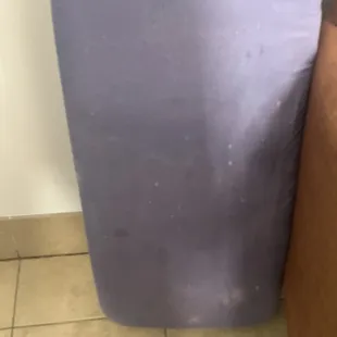 Filthy ironing board.