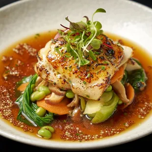 Alaskan Black Cod | Sake glaze, bok choy, edamame, shiitake mushrooms, yuzu dashi. ​