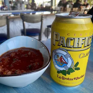 a can of beer and a bowl of soup