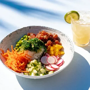 a bowl of food and a drink