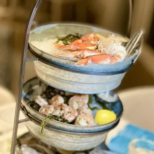 a stack of seafood dishes on a table