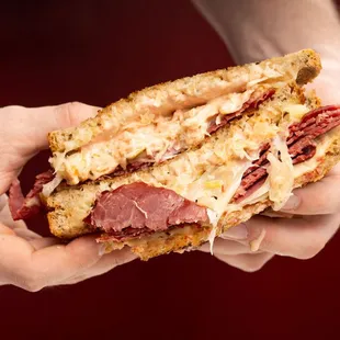 Reuben with our Housemade Corned Beef, Swiss Cheese, Russian Dressing &amp; Sauerkraut on Rye!