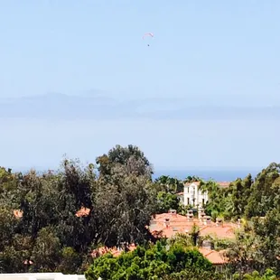 a view of the ocean from the roof of a house