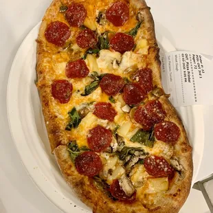 The 4.0 ($8.50) - any 4 toppings of your choice. This has pepperoni, pineapple, basil and mushrooms on wheat dough with tomato sauce