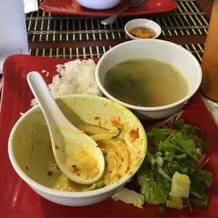 Yellow curry, salad, rice, soup and Thai tea.