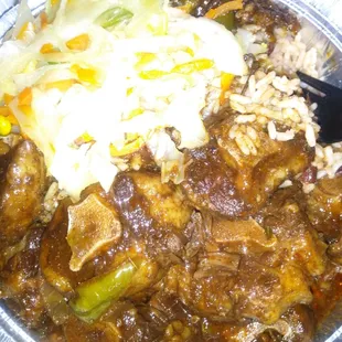 Large oxtails rice and peas cabbage plantain with nuff oxtail gravy $20