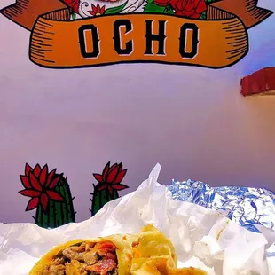 OCHO signature burrito with carne asada beef, red and green peppers and bacon