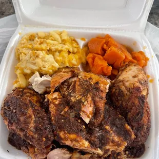 Jerk Chicken Over Rice And Peas With Mac And Yams.