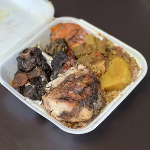 Jerk chicken, oxtail, rice and peas, potatoes