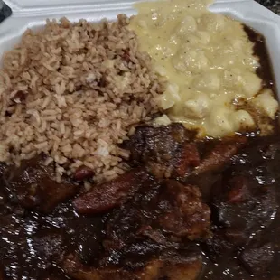 Oxtail. Mac and cheese. Rice and pea