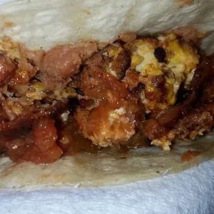 Homemade tacos made with Chicken Chorizo with egg, cheese, salsa and beans.