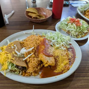 Ground Beef Taco, Tamale, Cheese/Onion Enchilada, Bean Tostada, Rice