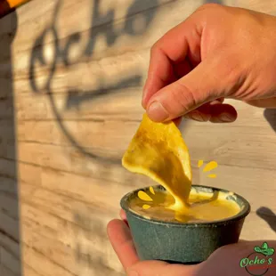 Homemade queso dip with fresh tortilla chips.
