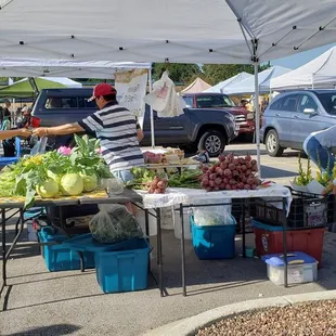 a woman selling vegetables