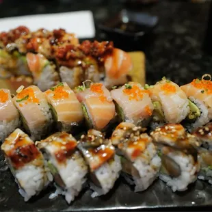 a plate of sushi rolls