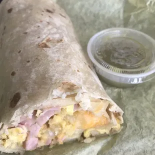 Ham and eggs with cheese burrito.