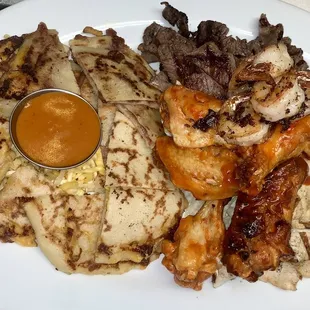 a plate of food with meat and sauce