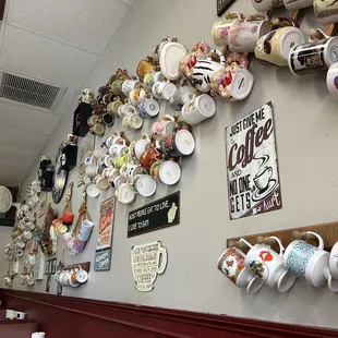 a wall full of coffee cups