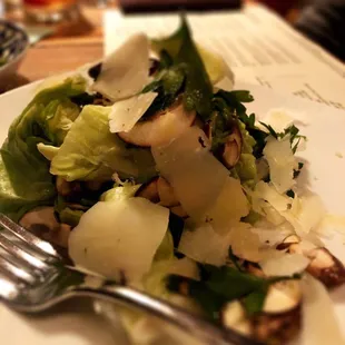 a white plate with a salad on it