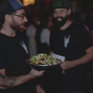 a man holding a plate of food