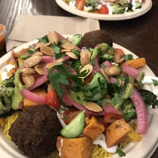 Falafel &amp; veggie plate. Veggie and chicken plate in the back