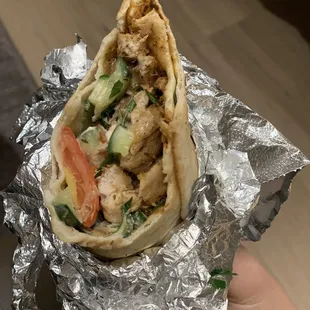 Half-eaten chicken shawarma. Sorry for not cute pic - it wasn&apos;t cut in half.