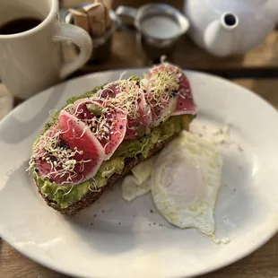 Avocado, watermelon radish toast with an egg sunny side up!