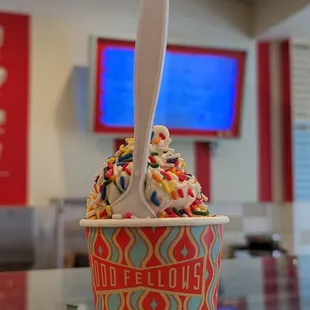 a scoop of ice cream with sprinkles