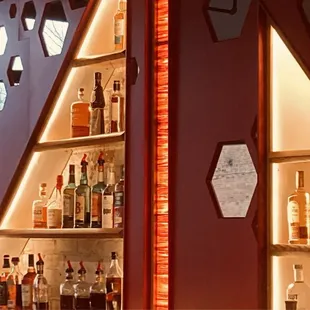 a shelf of liquor bottles