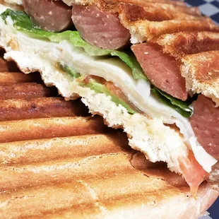 Turkey Sausage Torta with avocado, tomato, onions cheese and delicious signature sauce.