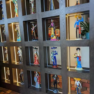 a display of mexican figurines