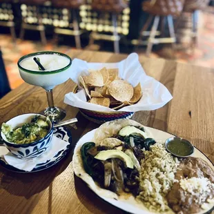 Brisket Tacos  House Margarita  Side of guacamole  *complimentary chips &amp; salsa