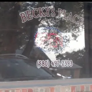 the reflection of a car in the window