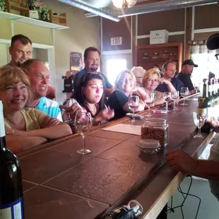 a group of people sitting at a bar