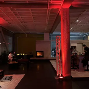 a living room with red lighting