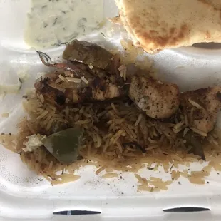 The rest of the chicken platter with old dry meat, old oily peppers &amp; shrivels of onion, and old oily rice.