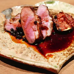 a plate of food on a wooden table